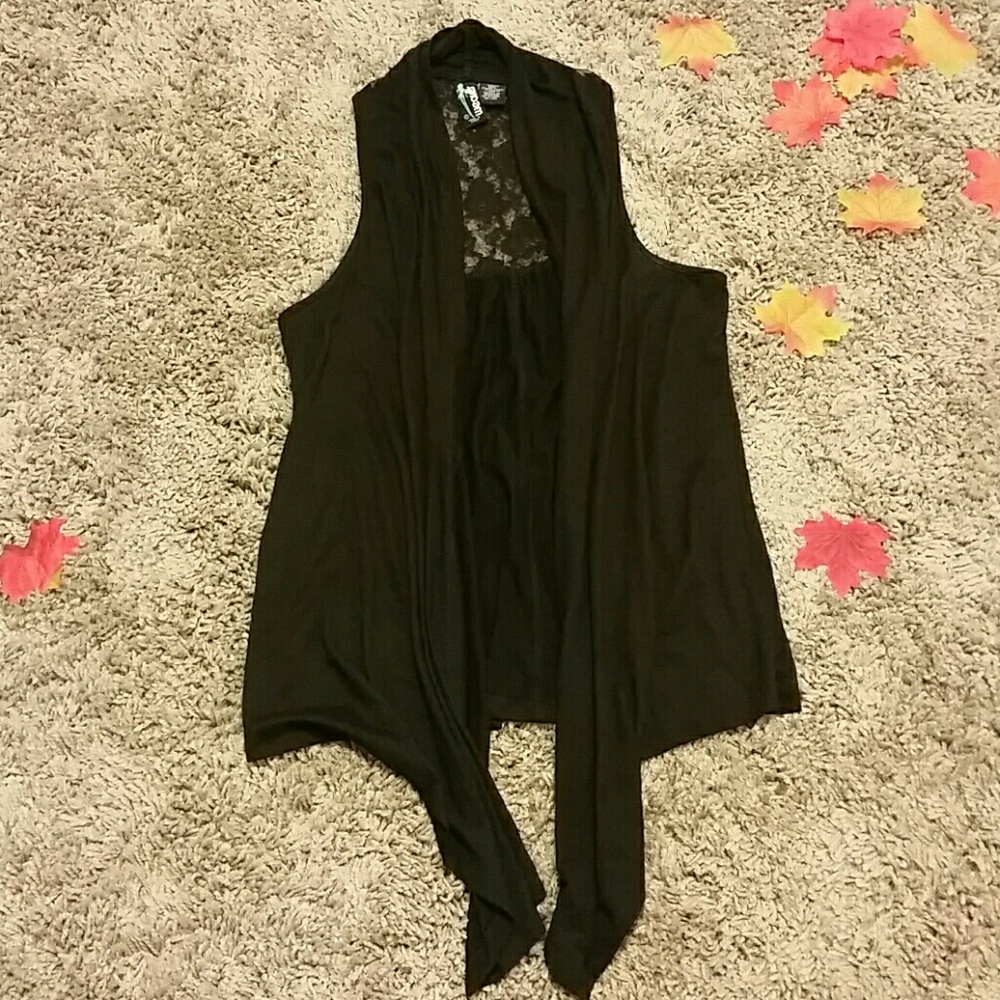Asymmetrical vest with lace cutout at back